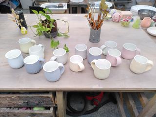 Set of 7 pairs of mugs painted in colourful glaze (yellow, light teal, light blue, dark blue, purple, green and grey)