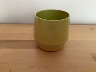 Angled planter glazed in a gradient of yellow to light green merging into the green inside at the top.