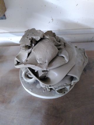 A big pile of wet clay on a bat