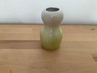 Little vase glaze green to white outside, blending into a white inside.