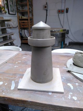 A lighthouse built of 3 clay forms
