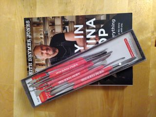 'A boy in a china shop' book from Keith Brymer Jones with a set of sculpting tools in their box on top of it.