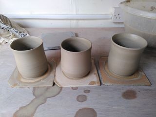 3 lightly bulbous mugs on their bats after throwing