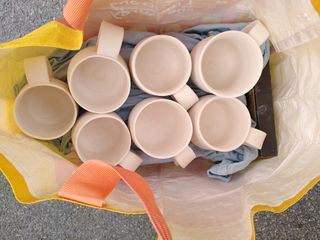 Bag filled with bisque fired mugs