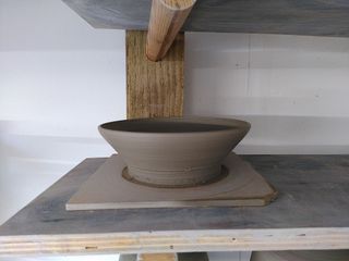 Close up of a small thrown bowl, its walls fairly straight at around 45 degrees