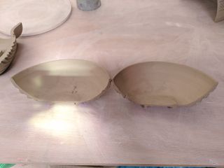 Halves of a carved bowl