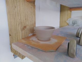 A tiny bowl with straight walls angled slighlty outwards