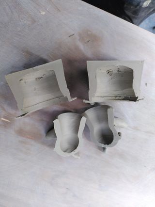 Halves of a top hat shaped jar and its lid