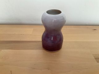 Little vase glazed purple to white outside, blending into a white inside.