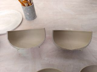 Halves of a carved bowl, with very regular walls