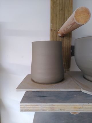 A mildly bulbous coned form with a flared rim
